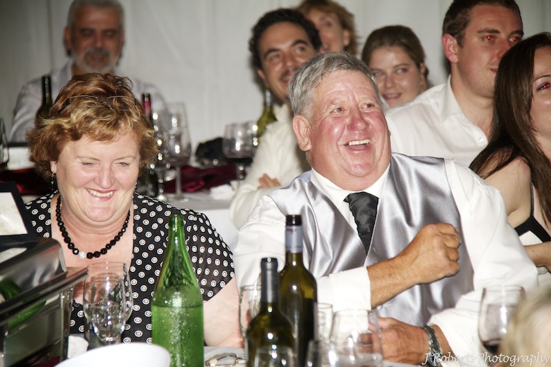 Guests laughing during speeches - wedding photography sydney